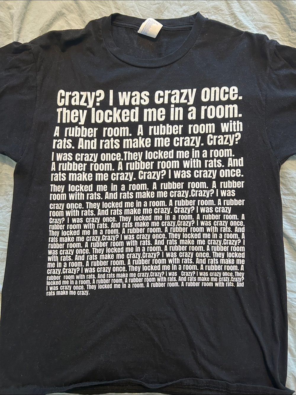Black Graphic Tee with Repeated Text Print